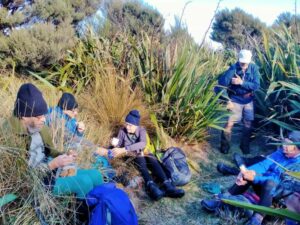 Lunch amongst the flax and tussock - well earned Caption and photo Phil