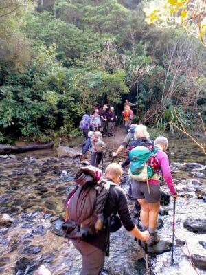 14 Aug Whare Flat Trampers Crossing The Upper Silverstream To Powder Creek Detourcaption & Photo Phil