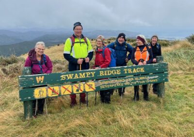 Happy Trampers At Top Of Swampy Ridge Track. Caption And Photo Pam