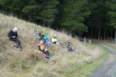 Lunch in the sun (n.b. the group around the corner). caption and photo john