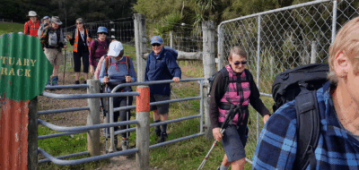 John lending a hand to get us through the kissing gate, orokonui estuary track caption and photo jane