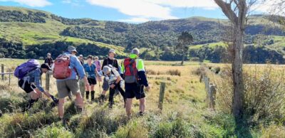 Over the fence into okia reserve our route down from ridge in background caption and photo jane