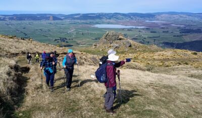 Heading up from our lunch rock with Lake Waipori beyond. Caption and photo Ross