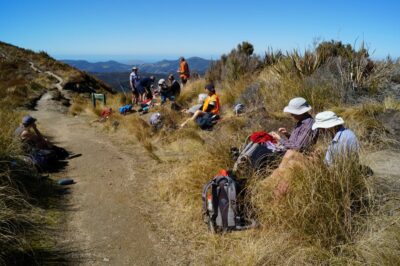 Lunch in the sun, on the track below Pulpit Rock. Caption and photo John